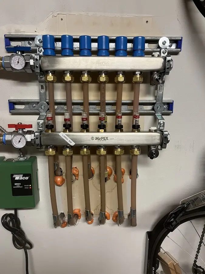 Plumber performing Water Heater Repair at a residential property in Addison